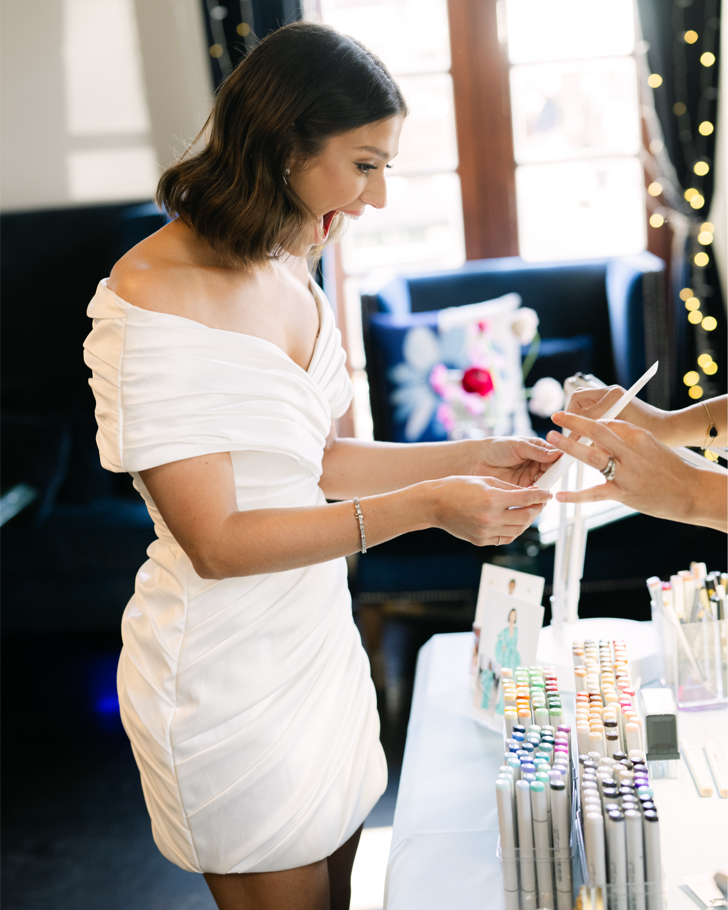 Bride reacting to live wedding portrait at an Florida reception