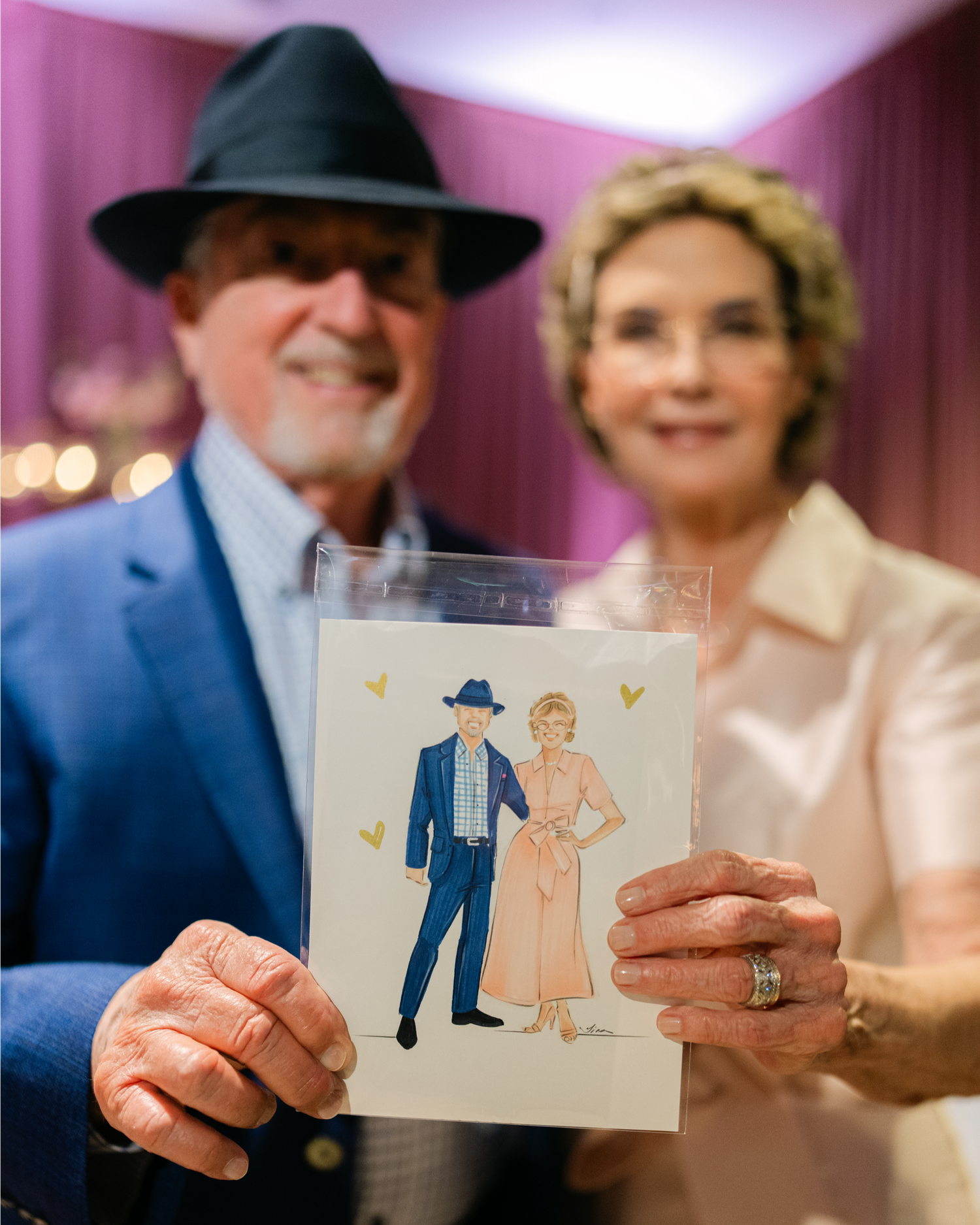 Couple holding their guest illustration received at a birthday celebration
