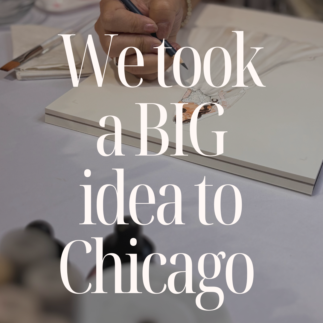 A person's hand holding a blue pencil, drawing on a white sketchbook at a table. Large white text overlay reads 'We took a BIG idea to Chicago'.