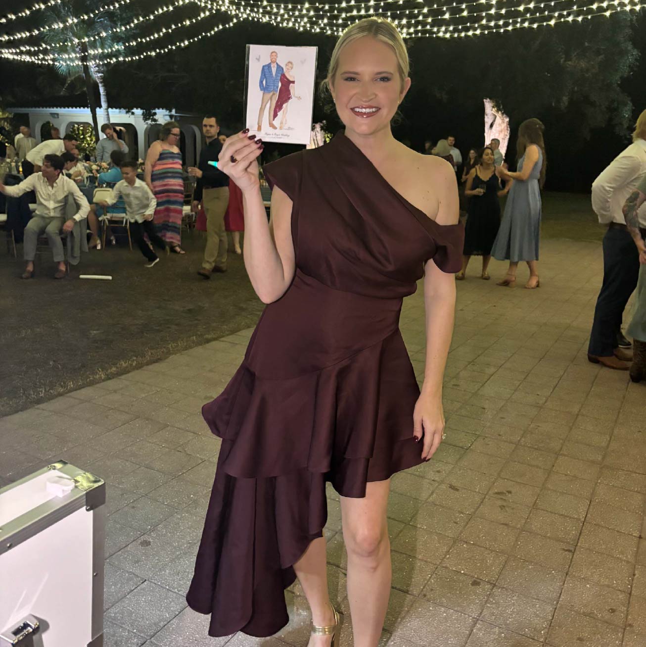 Wedding guest reacting to live fashion illustration at Sarasota reception